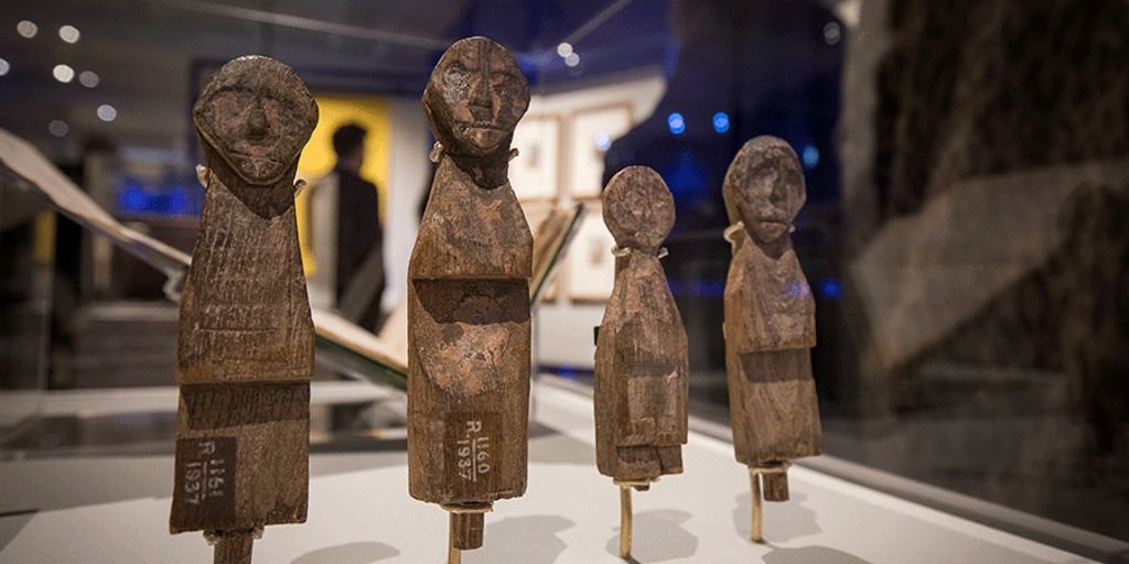 Ayurvedic medicine pills on a wooden table with herbs